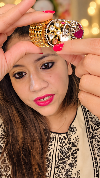 Openwork gold-tone kada with ruby-red doublet, coin pearl and kundan detailing