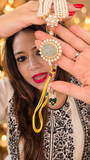 Jade-green carved medallion framed by kundan on a five-strand pearl necklace